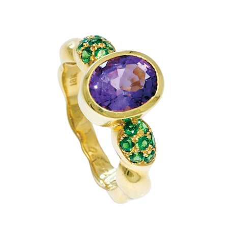 16880 Single Flowing Lines Amethyst & Tsavorite Ring Designed & Handmade by Kaufmann de Suisse in 18kt Yellow Gold featuring one Oval Amethyst weighing 1.93cts mounted with 14 Round Tsavorites wei