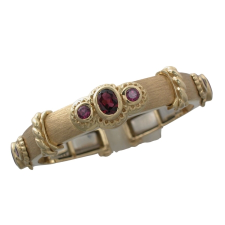 16444 Medium Width Rhodolite Garnet Callista Bangle Designed & Handmade by Kaufmann de Suisse in 18kt Yellow Gold featuring 9 Mixed Cut Rhodolite Garnets weighing a total of 7.86cts