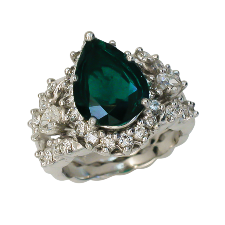 40144 Three Stone Flowing Lines Emerald & Diamond Ring Designed & Handmade by Kaufmann de Suisse in 18kt White Gold & Platinum featuring one Pear Shape Columbian Emerald AGS rated Minor weighing (1)