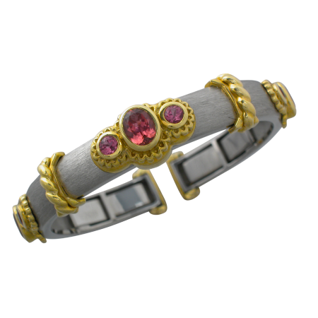 16524 Medium Wide Pink Tourmaline Callista Bangle Designed & Handmade by Kaufmann de Suisse in Stainless Steel and 18kt Yellow Gold featuring 9 Mixed cut Pink Tourmalines weighing a total of 5.13c