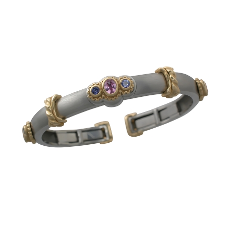 17507 Pink Sapphire & Tanzanite Callista Bangle Bracelet Designed & Handmade by Kaufmann de Suisse in 18kt Yellow Gold & Stainless Steel featuring 3 Oval Pink Sapphires weighing a total of 1.10cts