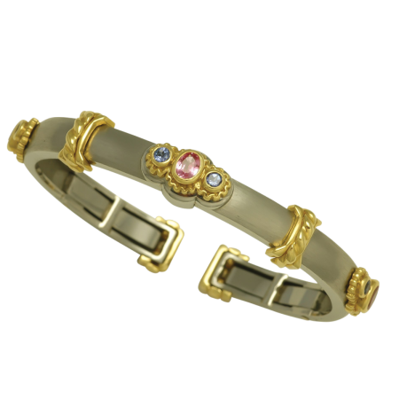 17507 Pink Sapphire & Tanzanite Callista Bangle Bracelet Designed & Handmade by Kaufmann de Suisse in 18kt Yellow Gold & Stainless Steel featuring 3 Oval Pink Sapphires weighing a total of 1.10cts