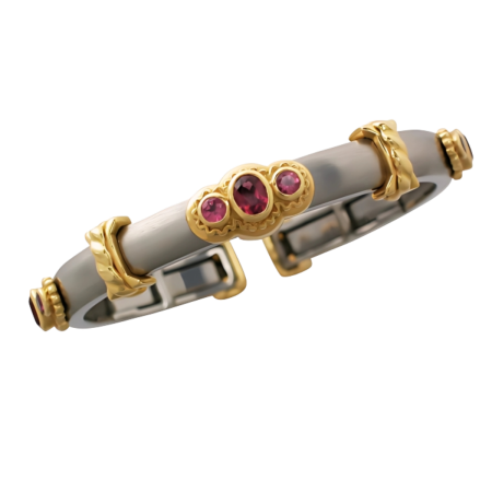 17786 Thin Pink Tourmaline Callista Bangle Designed & Handmade by Kaufmann de Suisse in Stainless Steel and 18kt Yellow Gold featuring 9 Mixed Cut Pink Tourmalines weighing a total of 1.76cts