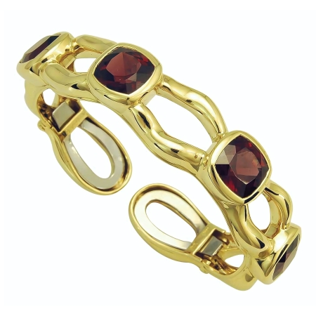 18939 Tsarina Rhodolite Clip Bangle Designed & Handmade by Kaufmann de Suisse in 18kt Yellow Gold featuring 4 Cushion cut Rhodolite Garnets weighing a total of 21.04cts