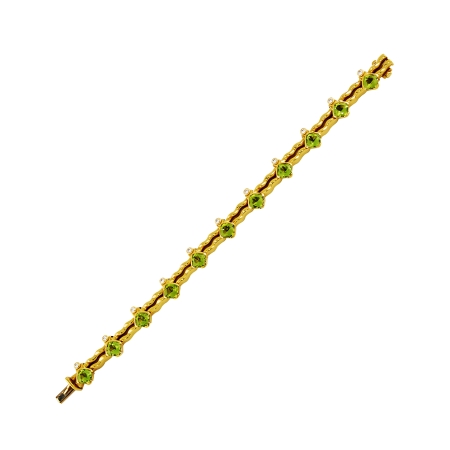 18942 Flowing Lines Peridot & Diamond Bracelet Designed & Handmade by Kaufmann de Suisse in 18kt Yellow Gold featuring 11 Cushion Cut Peridots weighing a total of 10.87cts and 11 Round Brilliant c