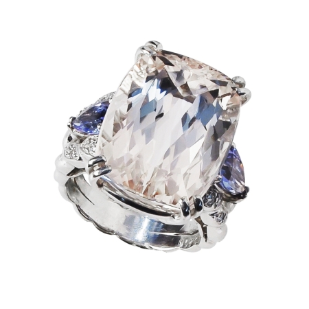 21500 Three Stone Double Flowing Line Kunzite, Tanzanite & Diamond Ring Designed and Handmade by Kaufmann de Suisse in Platinum featuring one Cushion Cut 25.66cts Kunzite, flanked by 2 pear Shaped