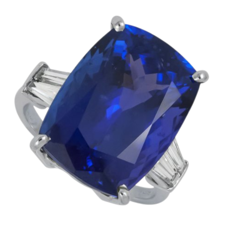 23392 Tanzanite and Diamond Ring, Handmade in 18k White Gold with a Center Tanzanite Weighing 16.36 Carats Total and 4 Diamond Baguettes Weighing .80 Carats Total