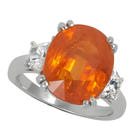31640 Mandarin Garnet and Diamond Ring Designed & Handmade by Kaufmann de Suisse in Platinum featuring 1 Oval Spessartite Garnet weighing 10.25cts flanked by two Shield Cut GVS Quality Diamonds we