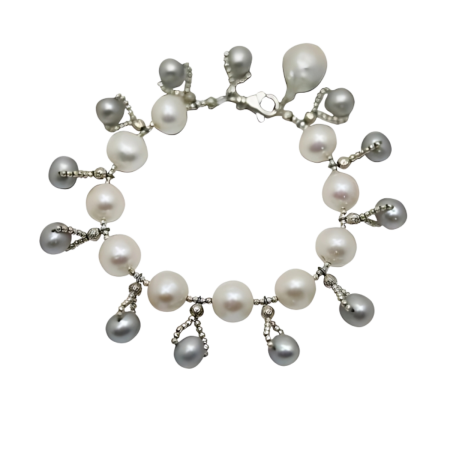 24434 White and Grey Freshwater Pearl Bracelet with BaroqueBeautifully Accented With Diamond Cut Sterling Silver BeadsIncludes a Certificate of Guarantee