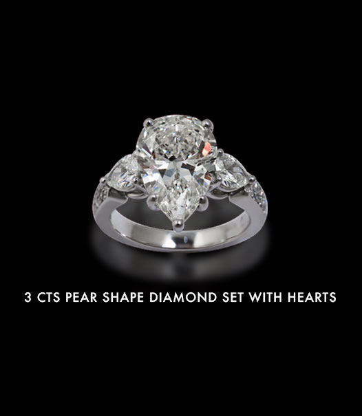 3 carats pear shape diamond set with hearts