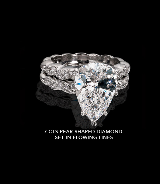 7-CTS-PEAR-SHAPE-DIAMOND-SET-IN-FLOWING-LINES 7 Carats Ring with Pear Shaped Diamond Set In Flowing Lines