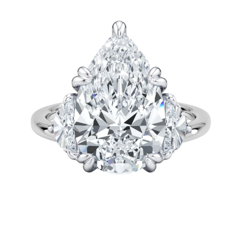 23427 Pear Shape Diamond Ring Designed and mounted in Platinum by Kaufmann de Suisse featuring one 6.84cts GS1 GIA Certified Pear Shape Diamond flanked by two Half Moon FVS