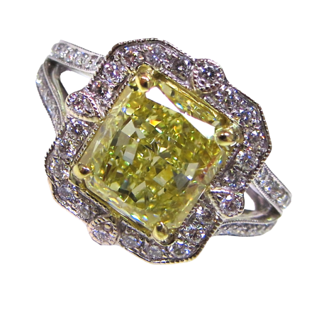 23450 Classic Antique Style Diamond Ring Designed and Handmade in 18kt Yellow & White Gold featuring one Radiant Cut GIA Certified 3.12cts Fancy Light Yellow Diamond mounted with 64 Round Brillian