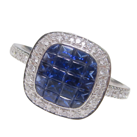 23789 Sapphire and Diamond Halo Ring Designed and Handmade in 18kt White Gold featuring 20 Mixed Shape Blue Sapphires weighing 1.60cts and 34 Round Brilliant Cut HSI Quality