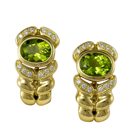 23900 Flowing Lines Peridot & Diamond Earclips Designed & Handmade by Kaufmann de Suisse in 18kt Yellow Gold featuring 2 Oval Checkerboard cut Peridots weighing a total of 17cts and 24 Round Brill