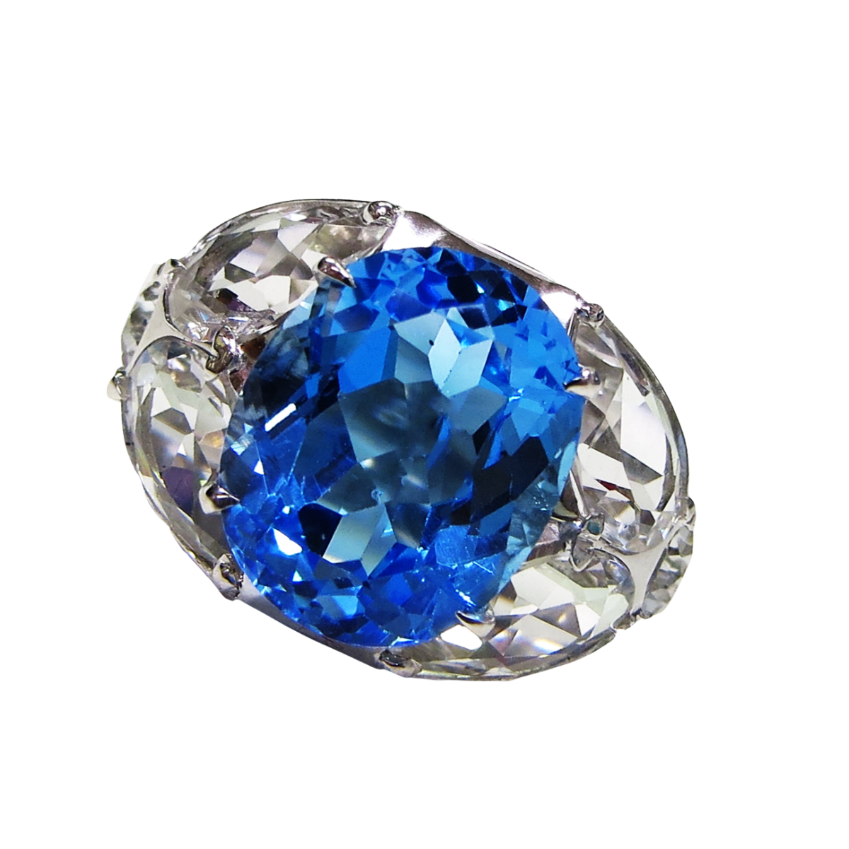 24211 Blue and White Topaz Lucky Seven Stone Ring Designed and Handmade by Kaufmann de Suisse in 18kt White Gold featuring 1 Oval cut Blue Topaz weighing 8.67cts