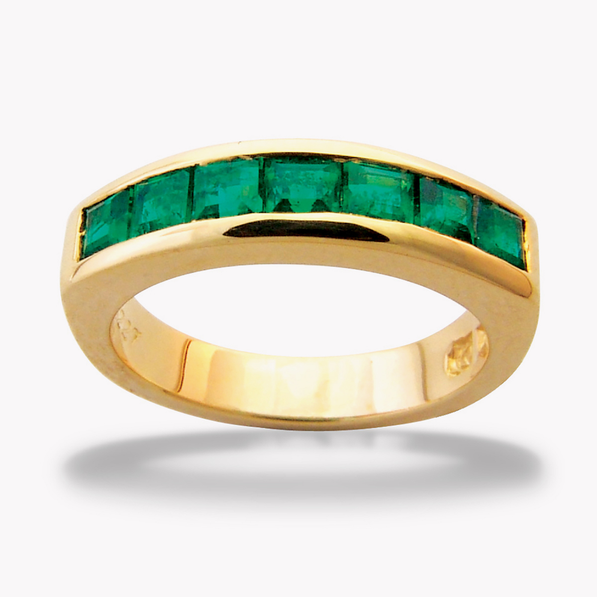 Unisex Channel Set Emerald Half Eternity Band in Yellow Gold