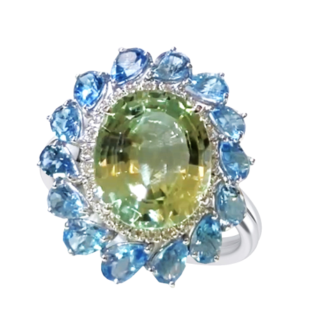 24611 Spodumene, Blue Topaz & Diamond Flower Ring featuring 1 Oval 25.42cts Spodumene, surrounded by 26 Round Brilliant Cut FVS Quality Diamonds weighing a total of 0.83cts and by 14 Pear Shaped B