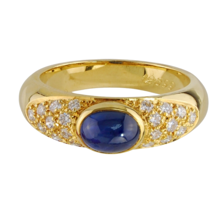 12399 Sapphire & Diamond Band Designed and Handmade by Kaufmann de Suisse in 18kt Yellow Gold featuring one Oval Cabochon cut Sapphire weighing 1.38cts and 20 FVVS Quality Round Diamonds weighing (1)