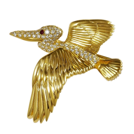 15181A Pelican Pin Designed and Handmade by Kaufmann de Suisse in 18kt Yellow Gold featuring one faceted Round Ruby weighing