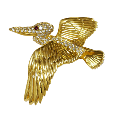 15181A Pelican Pin Designed and Handmade by Kaufmann de Suisse in 18kt Yellow Gold featuring one faceted Round Ruby weighing 0.05cts and 60