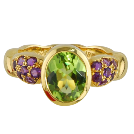 16879 Single Flowing Lines Peridot & Amethyst Ring Designed & Handmade by Kaufmann de Suisse in 18kt Yellow Gold featuring on Oval Peridot weighing 2.10cts mounted with 14 Round Brilliant Cut Amet