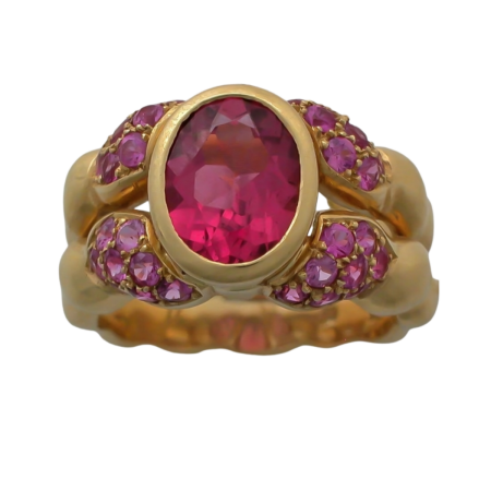 16916 Double Flowing Line Pink Tourmaline and Pink Sapphire Ring Designed & Handmade by Kaufmann de Suisse in 18kt Yellow Gold featuring 1 oval Pink Tourmaline weighing 1.76cts mounted with 32 Rou
