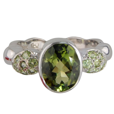 16963 Single Flowing Lines Peridot Ring Designed & Handmade by Kaufmann de Suisse in 18kt White Gold featuring 1 Oval cut Peridot weighing 2.05cts and 14 Bound Brilliant cut Peridot weighing a tot