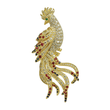 19136 Phoenix Pin Designed & Handmade by Kaufmann de Suisse in 18kt White Gold featuring 182 Round Brilliant Cut FVVS Quality Diamonds weighing a total of 5.63cts, 53 Round Brilliant cut Rubies we