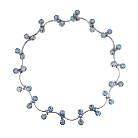 19673-One of a Kind Flowing Lines Wave Necklace Designed & Handmade by Kaufmann de Suisse in 18kt White Gold featuring 36 Round Brilliant Cut Sky Blue Topaz weighing a total of 34.15cts and 24 Round Brilliant Cut F/VVS Quality Diamonds weighing a total of 0.24cts