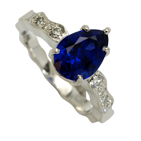21546 Single Flowing Lines Blue Sapphire Ring Designed & Handmade by Kaufmann de Suisse in 18kt White Gold featuring one Pear Shape 2.56cts Very Fine