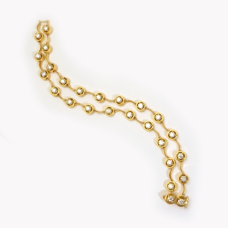 22233 Double Cascade Diamond Bracelet Designed and Handmade by Kaufmann de Suisse in 18kt Yellow Gold featuring 26 Round Brilliant Cut G VS Quality Diamonds weighing a total of 4.22cts