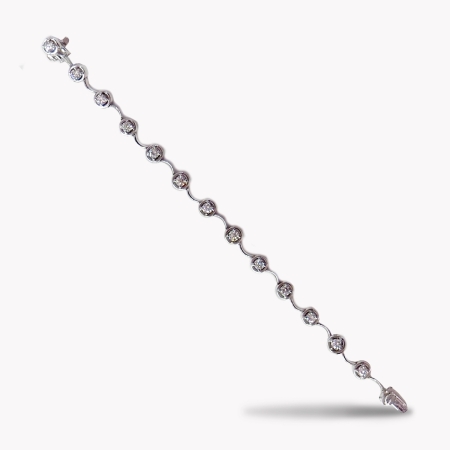 22616A Single Row Diamond Cascade Bracelet Designed & Handmade by Kaufmann de Suisse in 18kt White Gold featuring 13 Round Brilliant Cut H SI Quality Diamonds weighing a total of 2.69cts