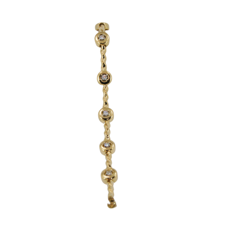 30178 Flowing Lines Diamond Bracelet Designed and Handmade by Kaufmann de Suisse in 18kt Yellow Gold and Platinum featuring 7 Round Brilliant cut GVS Quality Diamonds weighing a total of 1.09cts